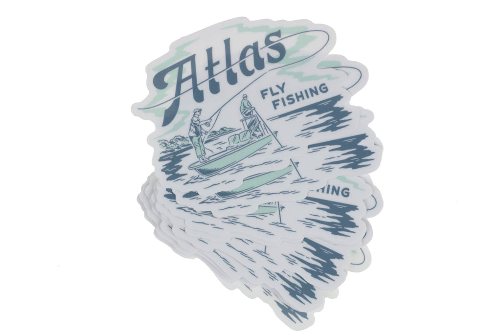 Stack of die-cut Atlas fly fishing stickers in white vinyl with blue and mint green boat illustration and vintage script logo